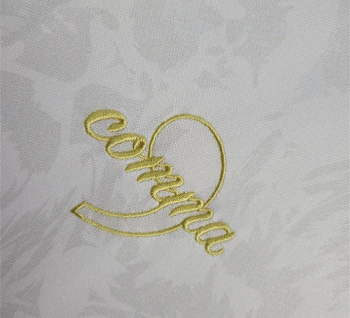 maillotangleterrecommablancmarque.jpg Maillot Concept Angleterre Édition Comma Blanc 2024 detail tissu