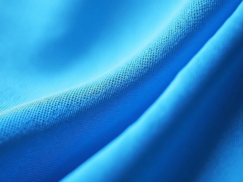 Texture de tissu polyester d'un maillot de foot sous grossissement, montrant la maille synthétique